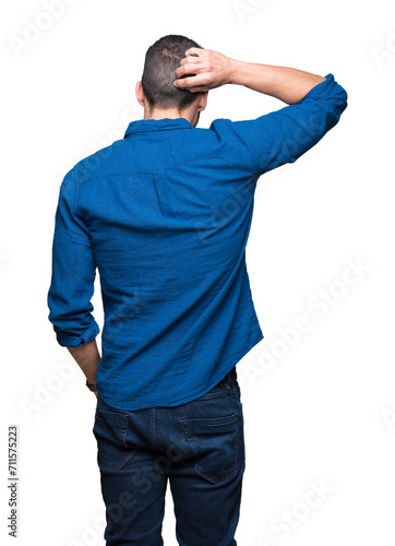 Young handsome man over isolated background Backwards thinking about doubt with hand on head