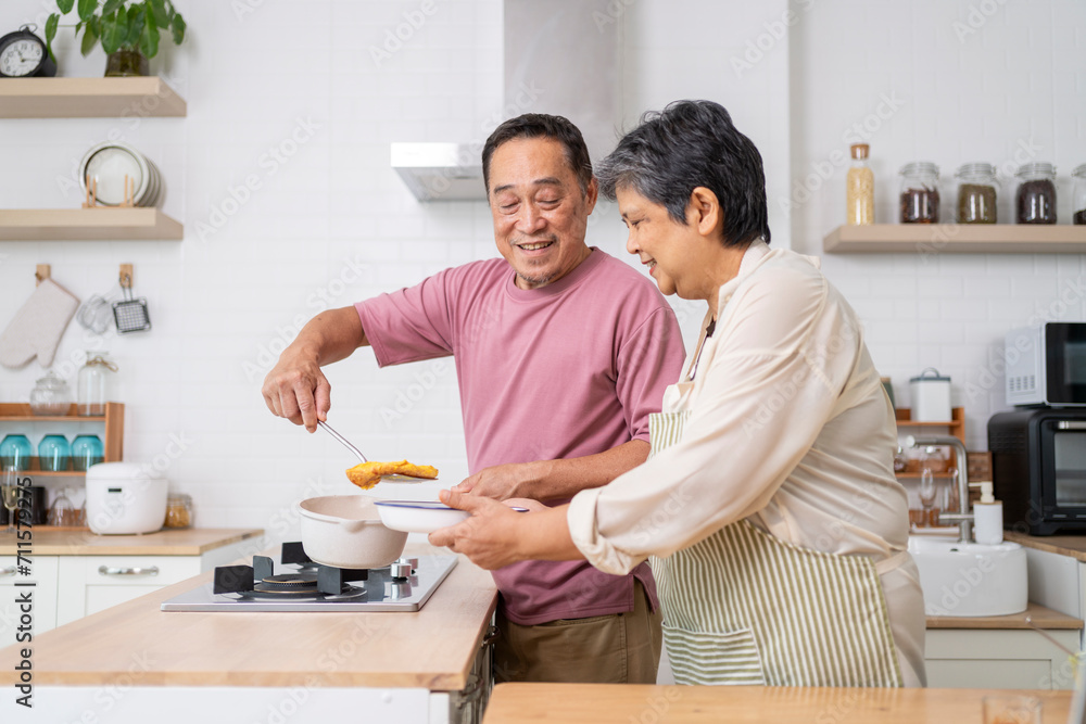 Mature asian Couples enjoy to cooking meal together in kitchen. Mature asian Couples enjoy to cooking meal together in kitchen.