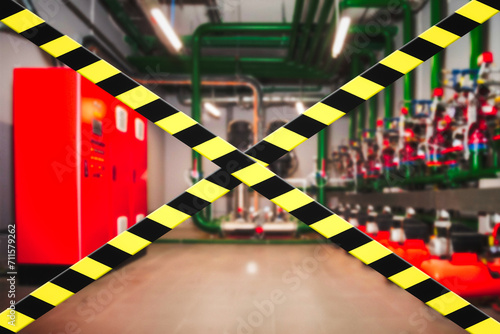 Barrier warning black yellow lines on industry room inside, danger zone, do not enter. Unsafe closed industrial area from barrier cross types. Production shutdown concept, no open. Copy ad text space