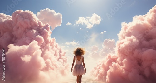 A woman angel with wings and in a white dress walks among the clouds. Concept: Dreams and sleep