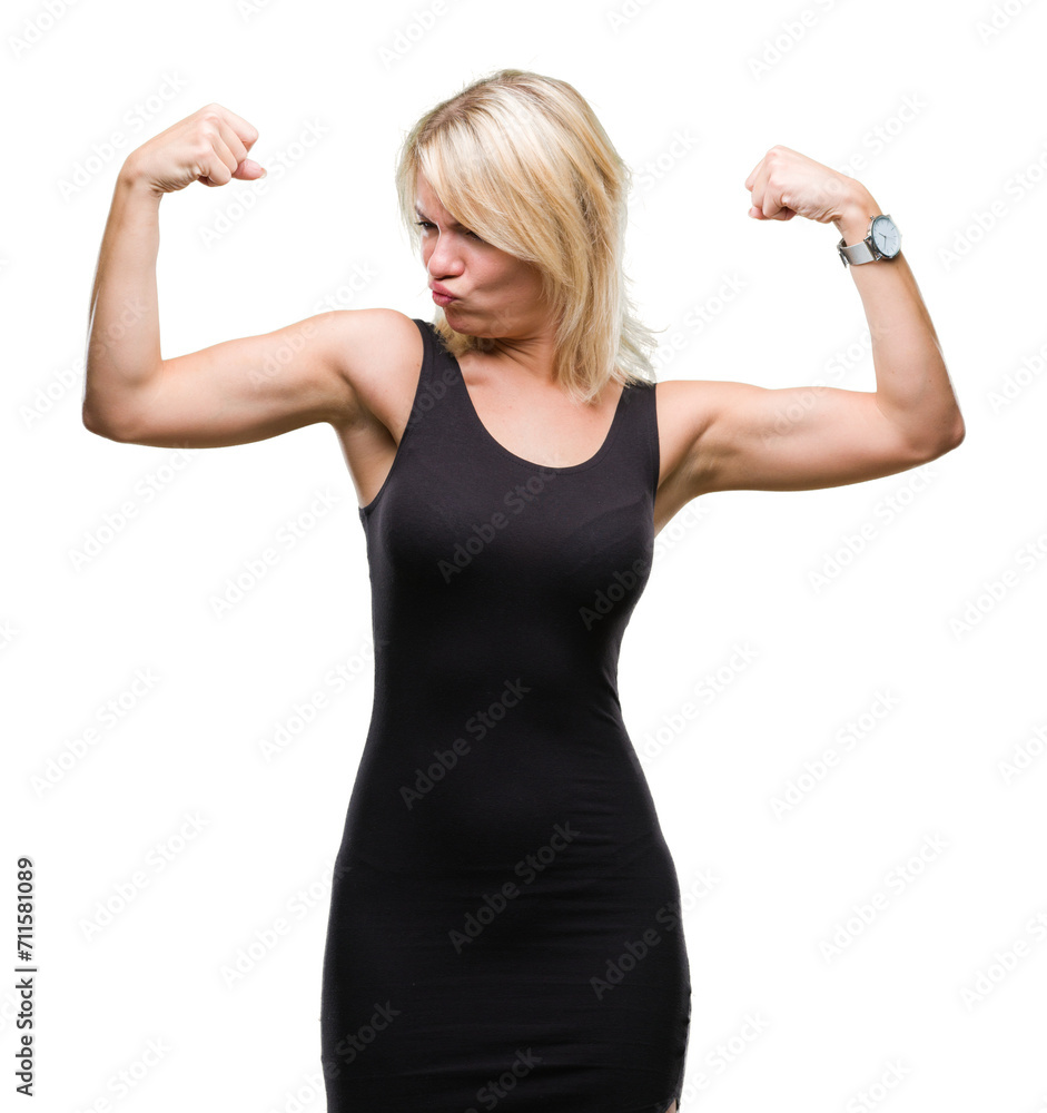 Young beautiful blonde attractive woman wearing elegant dress over isolated background showing arms muscles smiling proud. Fitness concept. Young beautiful blonde attractive woman wearing elegant dress over isolated background showing arms muscles smiling proud. Fitness concept.