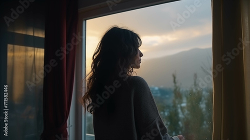 Caucasian woman looking at the scenery outside the window.