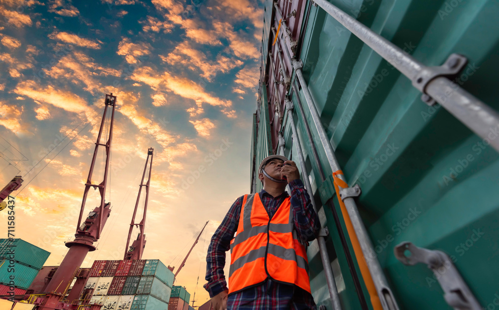 Fototapeta premium Quality Control Officer inspecting warehouses at containers yard for international shipping businesses