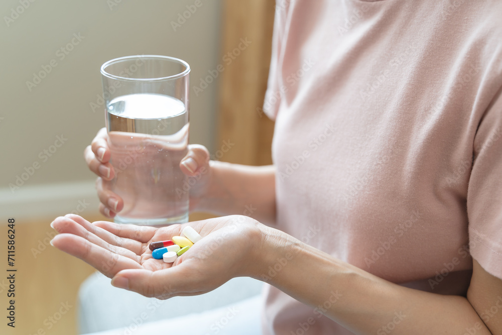 Healthcare Harmony: Close-Up Hands Holding Medication and Water Glass for Optimal Wellness, Pharmaceutical Treatment and mental health treatment Healthcare Harmony: Close-Up Hands Holding Medication and Water Glass for Optimal Wellness, Pharmaceutical Treatment and mental health treatment