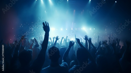 live, rock concert, party, festival night club crowd cheering, stage lights and confetti falling. Cheering crowd. Blue lights.