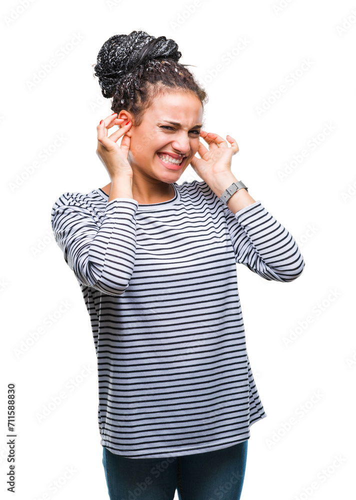 Young braided hair african american girl wearing sweater over isolated background covering ears with fingers with annoyed expression for the noise of loud music. Deaf concept. Young braided hair african american girl wearing sweater over isolated background covering ears with fingers with annoyed expression for the noise of loud music. Deaf concept.