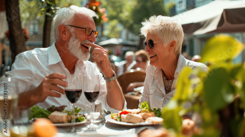 Healthiness and happiness go hand in hand. Shot of a happy older couple enjoying a healthy lunch together outdoors.