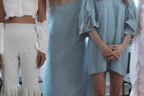 Fashion details of long blue cotton outfits. Fashion backstage