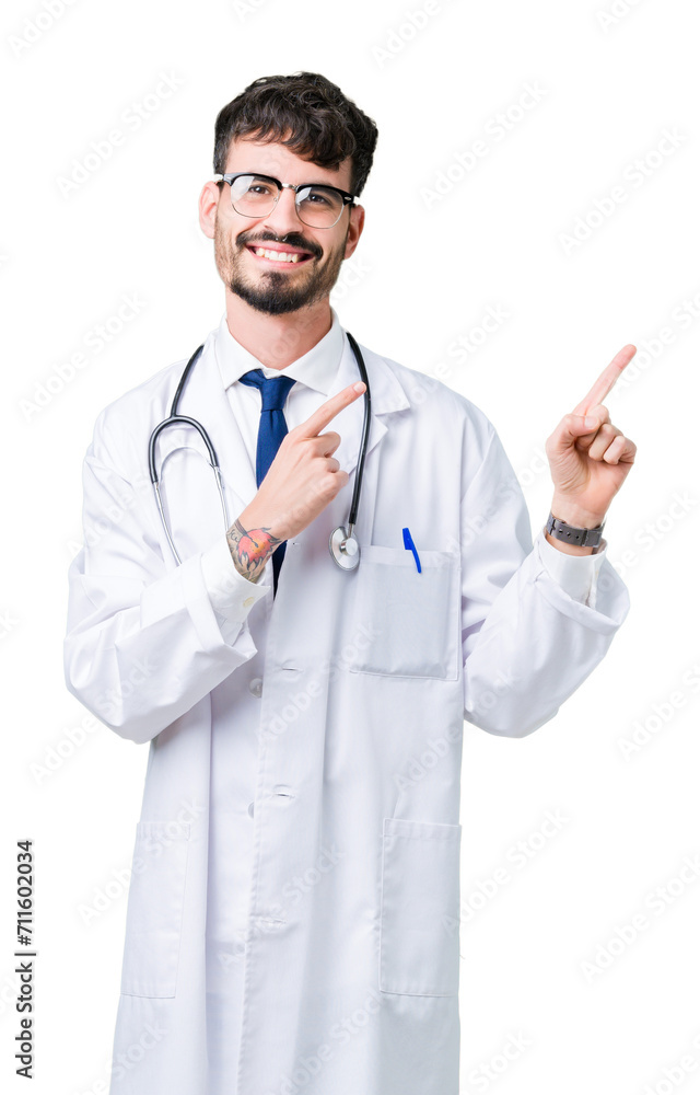 Young doctor man wearing hospital coat over isolated background smiling and looking at the camera pointing with two hands and fingers to the side. Young doctor man wearing hospital coat over isolated background smiling and looking at the camera pointing with two hands and fingers to the side.