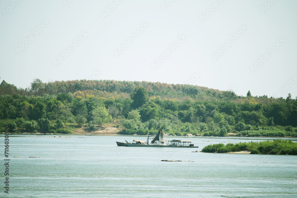 Obraz premium The Mekong River, mukdahan thailand sand dredging in the river.
