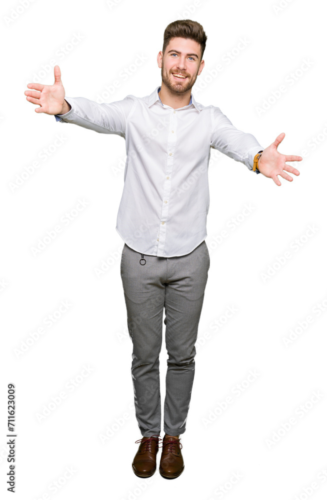 Young handsome business man looking at the camera smiling with open arms for hug. Cheerful expression embracing happiness. Young handsome business man looking at the camera smiling with open arms for hug. Cheerful expression embracing happiness.