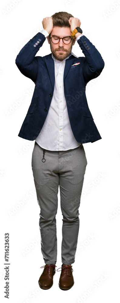 Young handsome business man wearing glasses suffering from headache desperate and stressed because pain and migraine. Hands on head. Young handsome business man wearing glasses suffering from headache desperate and stressed because pain and migraine. Hands on head.
