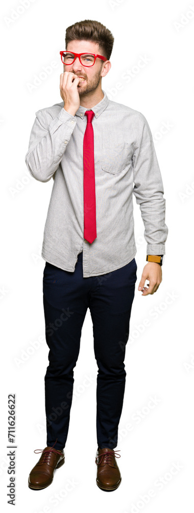 Young handsome business man wearing glasses looking stressed and nervous with hands on mouth biting nails. Anxiety problem. Young handsome business man wearing glasses looking stressed and nervous with hands on mouth biting nails. Anxiety problem.