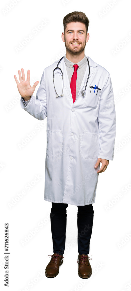 Young handsome doctor man wearing medical coat showing and pointing up with fingers number five while smiling confident and happy. Young handsome doctor man wearing medical coat showing and pointing up with fingers number five while smiling confident and happy.