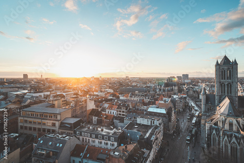 Watching the sunset over Ghent from the historic tower in the city centre. Romantic colours in the sky. Red light illuminating Ghent, Flanders region, Belgium