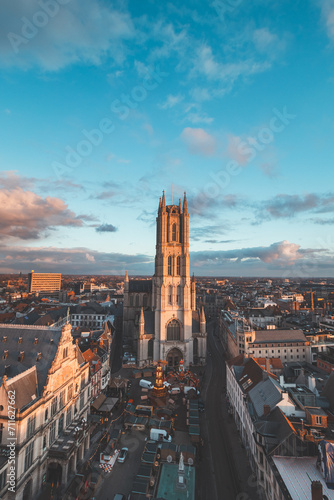Watching the sunset over Ghent from the historic tower in the city centre. Romantic colours in the sky. Red light illuminating Ghent, Flanders region, Belgium