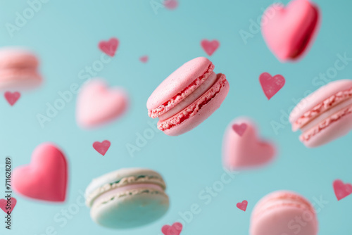 Pink macaroons flying on a pastel background with red love hearts. Valentines sweet gift