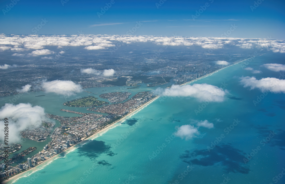 Amazing aerial view of Miami Beach skyline and coastline from a departing airplane