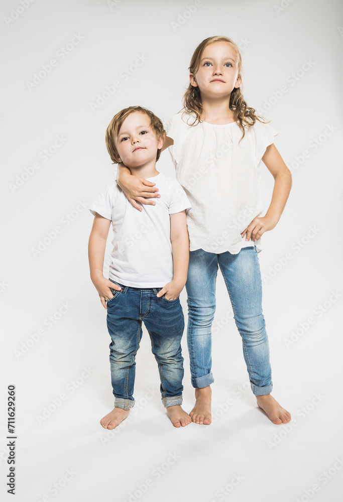Portrait of two children in studio with white background. Portrait of two children in studio with white background.