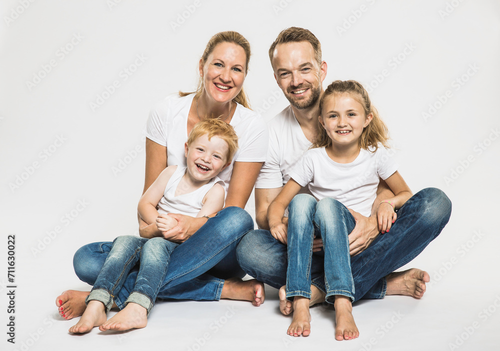 Portrait of family in studio with white background. Portrait of family in studio with white background.