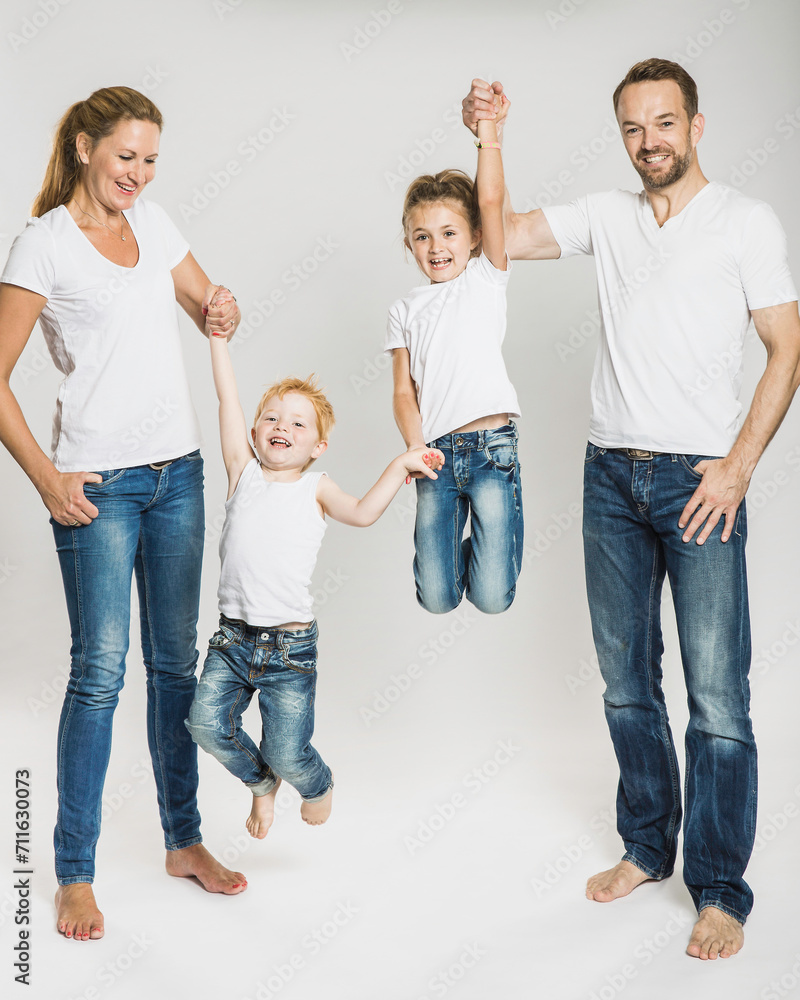 Portrait of family in studio with white background. Portrait of family in studio with white background.