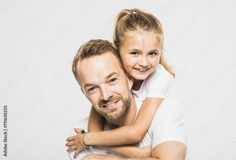 Portrait of father with daughter in studio with white background. Portrait of father with daughter in studio with white background.