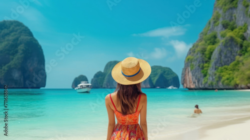 Traveler Asian woman in summer dress joy relaxing on sunny beach. © Santy Hong