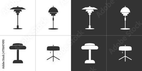 Four flat icons of table lamps. Black and white