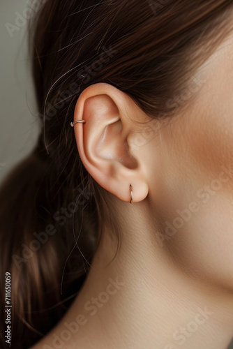 macro image of a female ear, concept of healthy hearing or ear jewelry