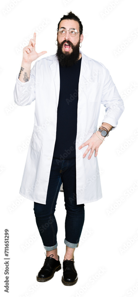 Doctor therapist man with long hair and bear wearing white coat pointing finger up with successful idea. Exited and happy. Number one. Doctor therapist man with long hair and bear wearing white coat pointing finger up with successful idea. Exited and happy. Number one.