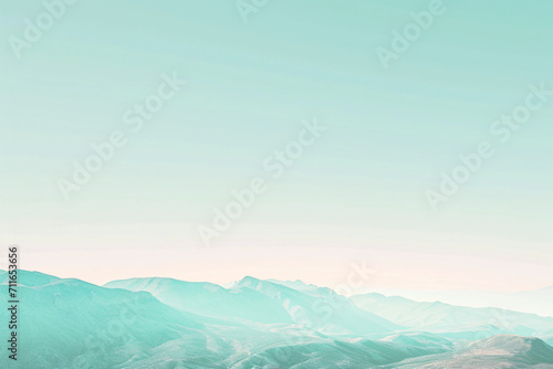 Pastel mountain range under a soft gradient sky