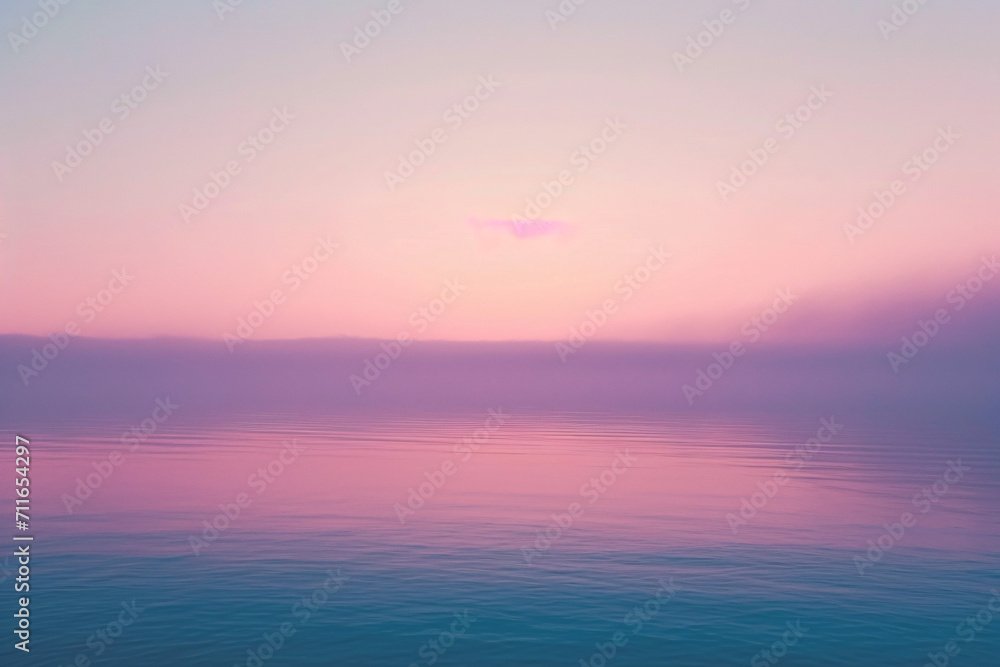Pastel pink and purple hues over a tranquil sea at sunset