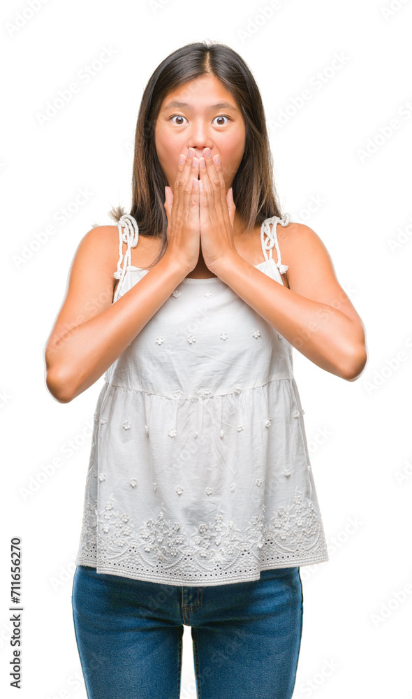 Young asian woman over isolated background shocked covering mouth with hands for mistake. Secret concept. Young asian woman over isolated background shocked covering mouth with hands for mistake. Secret concept.