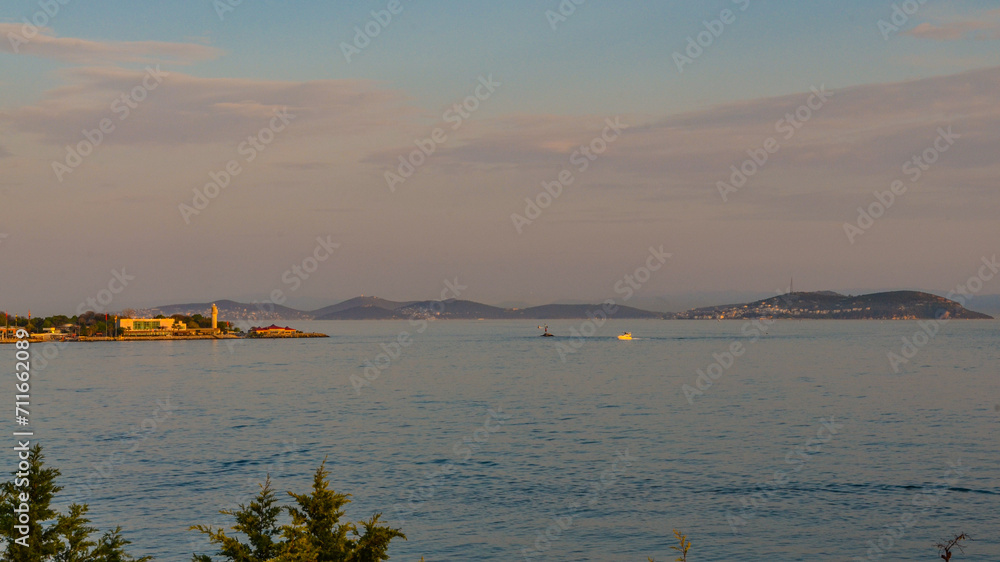 Fenerbahce point and Princes' islands sunset view from Moda promenade (Istanbul, Turkiye)