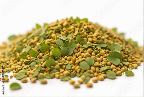 Fenugreek leaves with seeds on white background photo