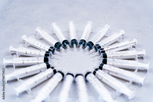 Free circle composition created with single-use pharmaceutical material syringes to distribute in hospitals and clinics