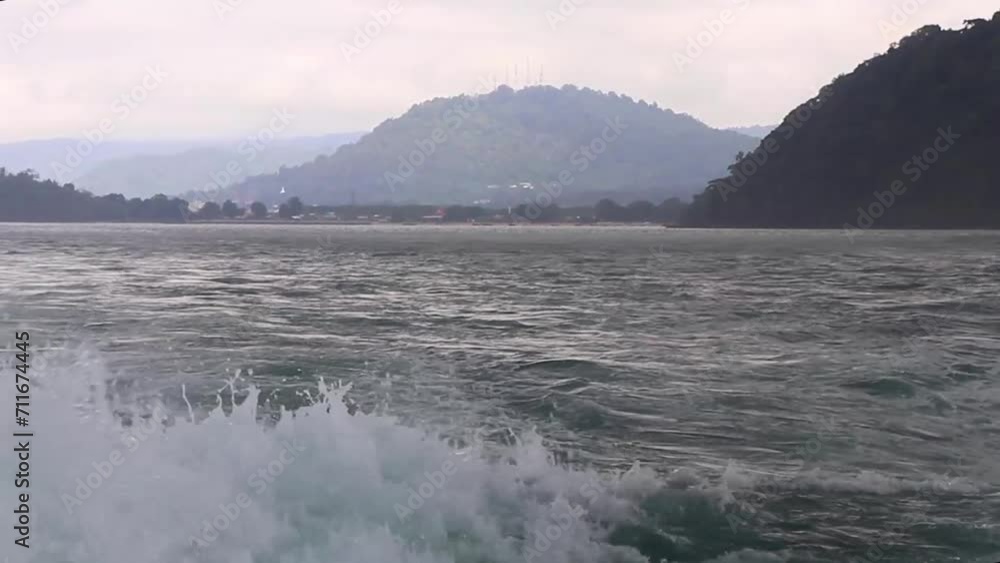 Travel Thailand by ferry boat yacht waves through tropical landscape. Travel Thailand by ferry boat yacht waves through tropical landscape.
