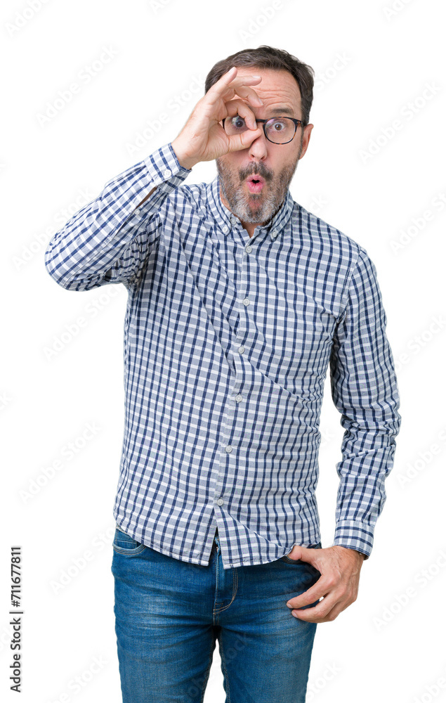 Handsome middle age elegant senior man wearing glasses over isolated background doing ok gesture shocked with surprised face, eye looking through fingers. Unbelieving expression. Handsome middle age elegant senior man wearing glasses over isolated background doing ok gesture shocked with surprised face, eye looking through fingers. Unbelieving expression.