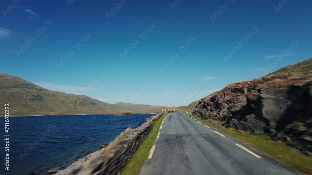 Driving on road beside lake First Point of view Scotland Driving on road beside lake First Point of view Scotland
