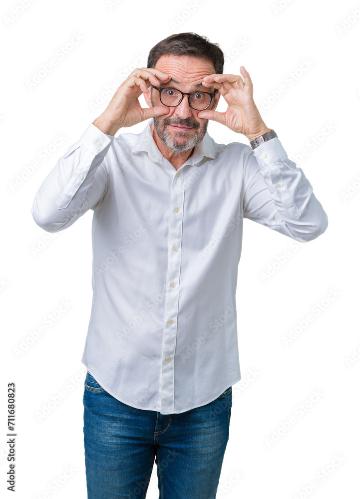 Fototapeta premium Handsome middle age elegant senior business man wearing glasses over isolated background Trying to open eyes with fingers, sleepy and tired for morning fatigue