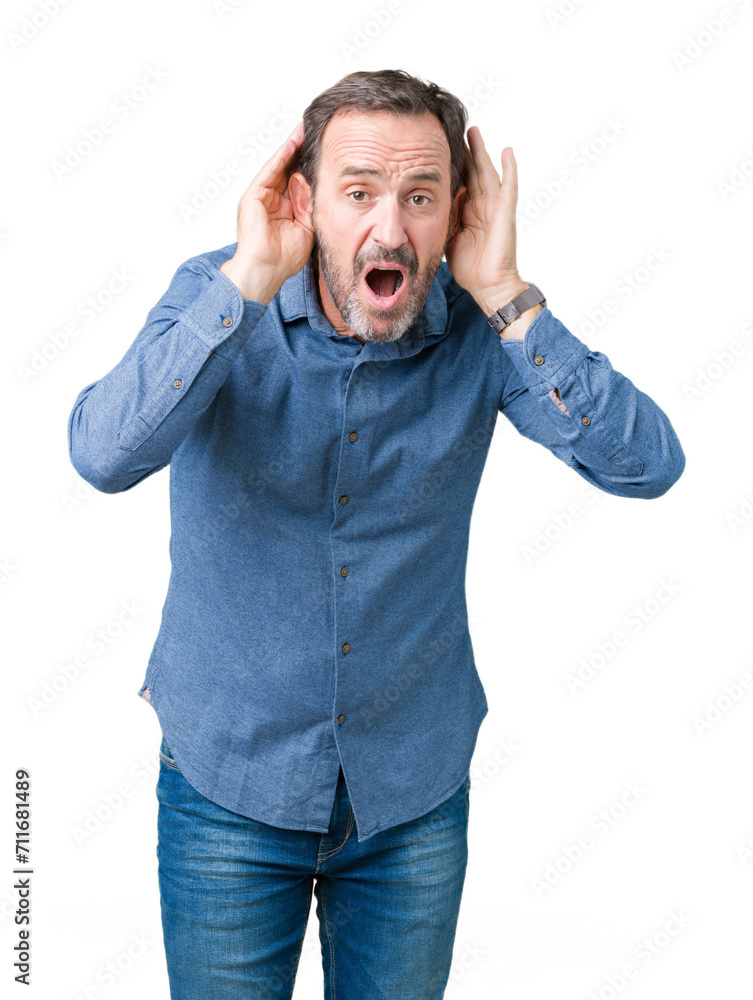 Handsome middle age elegant senior man over isolated background Trying to hear both hands on ear gesture, curious for gossip. Hearing problem, deaf Handsome middle age elegant senior man over isolated background Trying to hear both hands on ear gesture, curious for gossip. Hearing problem, deaf