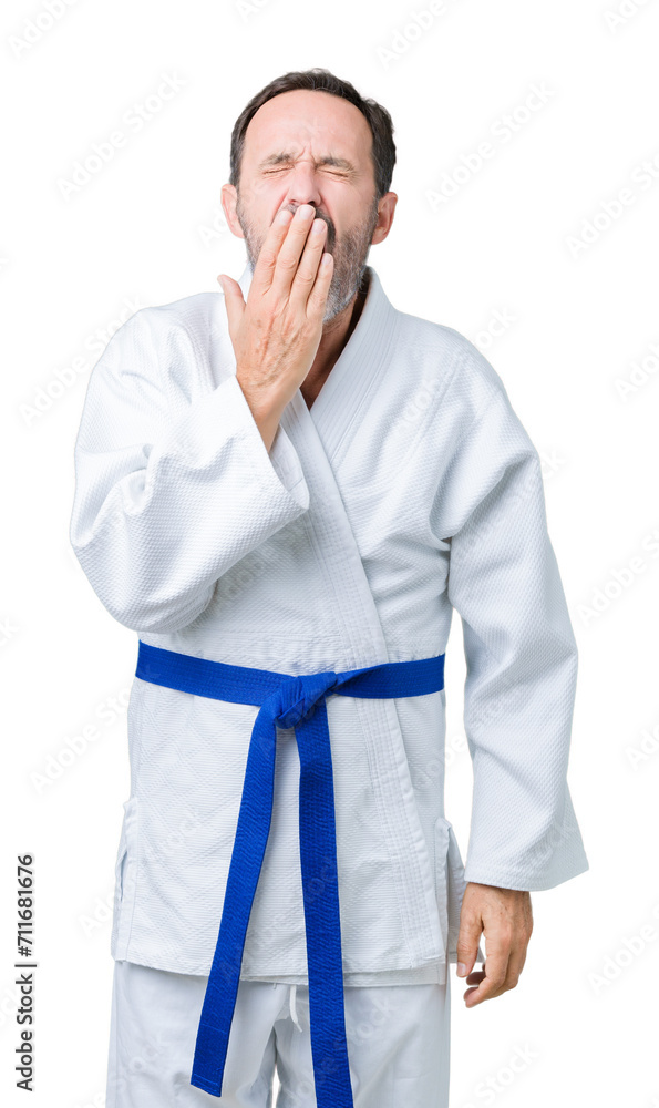 Handsome middle age senior man wearing kimono uniform over isolated background bored yawning tired covering mouth with hand. Restless and sleepiness. Handsome middle age senior man wearing kimono uniform over isolated background bored yawning tired covering mouth with hand. Restless and sleepiness.