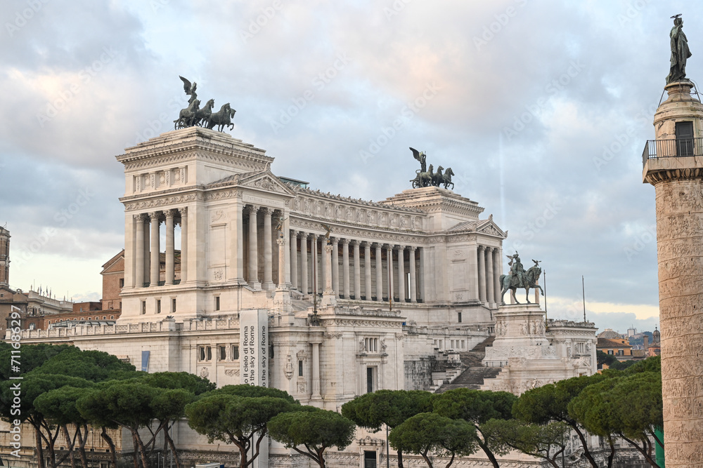 Trajan Column and Facade of the Victorian in Rome, Italy  during the day at sunset.Emmanuel II monument and The Altare della Patria