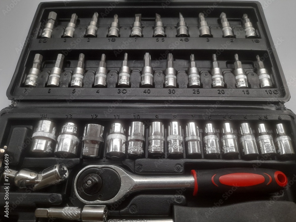 ratchet socket wrench set top view on white background. background concept of transport, transportation, workshop, repair, mechanic, hand tool, maintenance, lifestyle, technology, equipment, industry ratchet socket wrench set top view on white background. background concept of transport, transportation, workshop, repair, mechanic, hand tool, maintenance, lifestyle, technology, equipment, industry