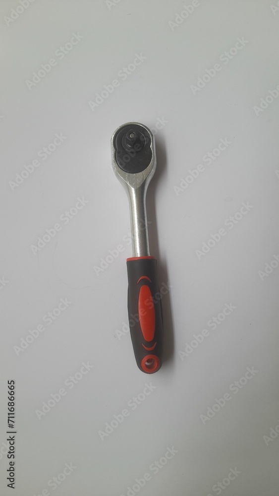 ratchet socket wrench handle top view on white background. background concept of transport, transportation, workshop, repair, mechanics, hand tools, maintenance, lifestyle, technology, equipment ratchet socket wrench handle top view on white background. background concept of transport, transportation, workshop, repair, mechanics, hand tools, maintenance, lifestyle, technology, equipment