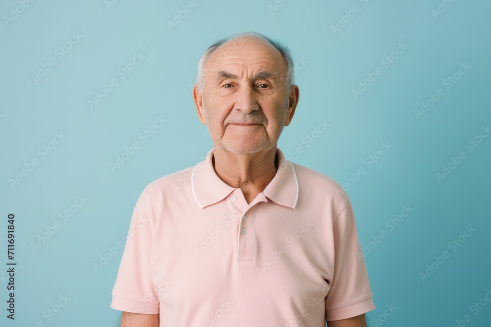 Portrait of a Senior Gentleman with a Kind Expression in Pink Polo. Generative AI. Portrait of a Senior Gentleman with a Kind Expression in Pink Polo. Generative AI.