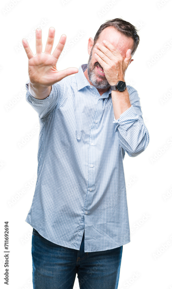 Middle age hoary senior business man over isolated background covering eyes with hands and doing stop gesture with sad and fear expression. Embarrassed and negative concept. Middle age hoary senior business man over isolated background covering eyes with hands and doing stop gesture with sad and fear expression. Embarrassed and negative concept.
