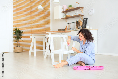 woman sitting on the floor with a laptop © Dasha Petrenko