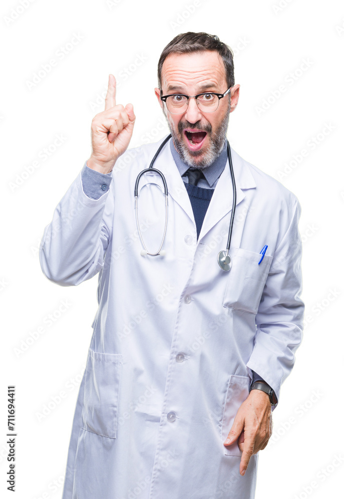 Middle age senior hoary doctor man wearing medical uniform isolated background pointing finger up with successful idea. Exited and happy. Number one. Middle age senior hoary doctor man wearing medical uniform isolated background pointing finger up with successful idea. Exited and happy. Number one.