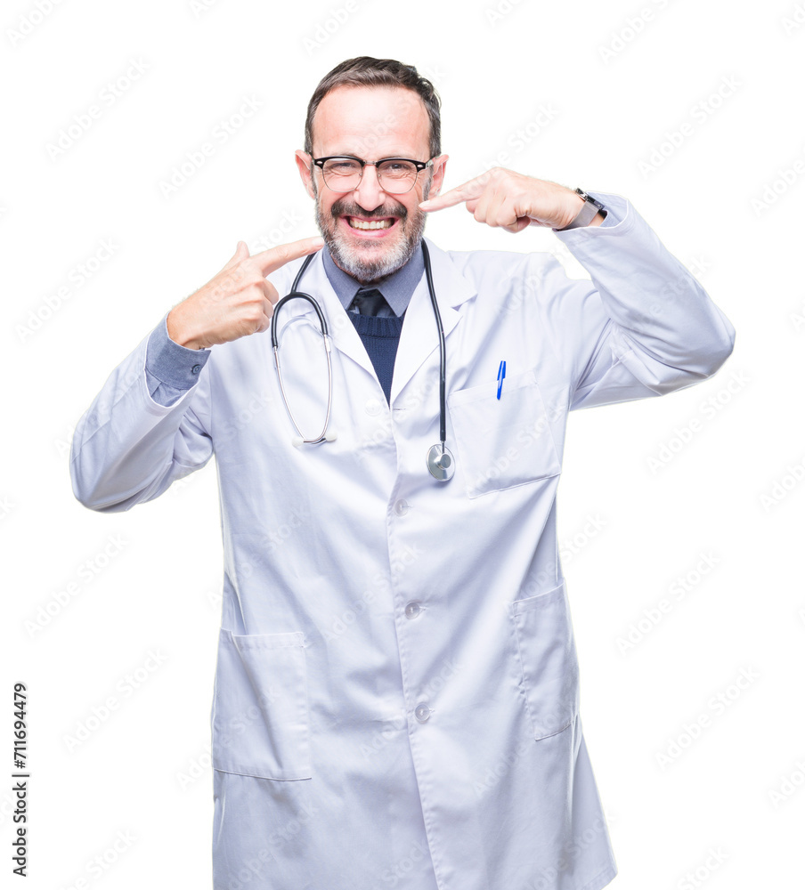 Middle age senior hoary doctor man wearing medical uniform isolated background smiling confident showing and pointing with fingers teeth and mouth. Health concept. Middle age senior hoary doctor man wearing medical uniform isolated background smiling confident showing and pointing with fingers teeth and mouth. Health concept.